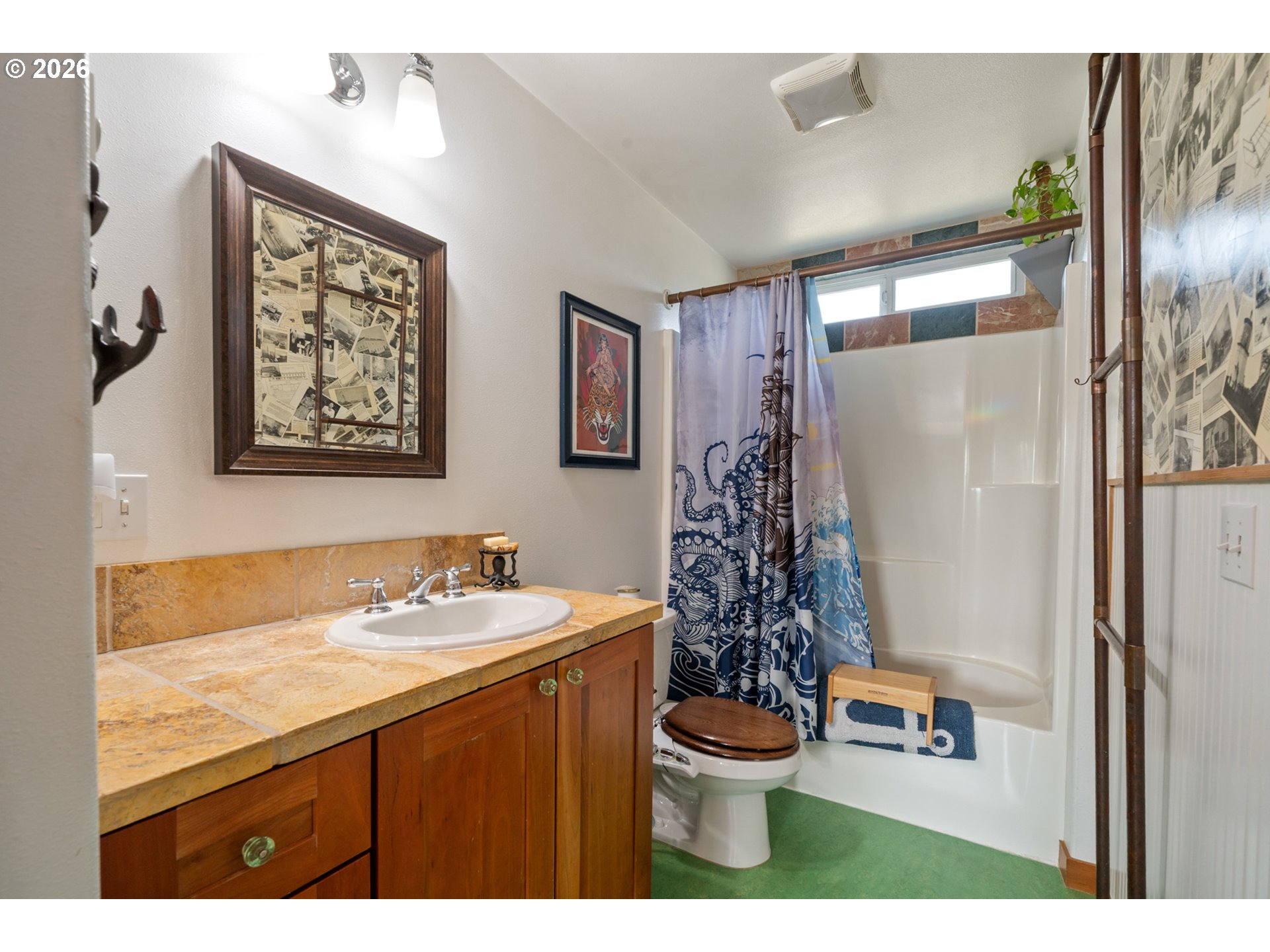 1055 Phelps Street Tillamook, OR 97141 - Photo 22 of 40 a bathroom with a sink toilet and shower