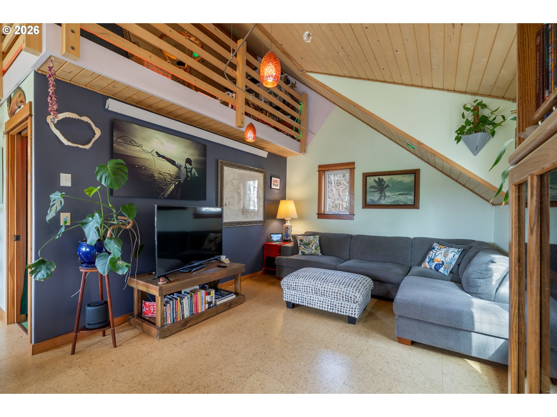 1055 Phelps Street Tillamook, OR 97141 - Photo 26 of 40 a living room with furniture and a flat screen tv