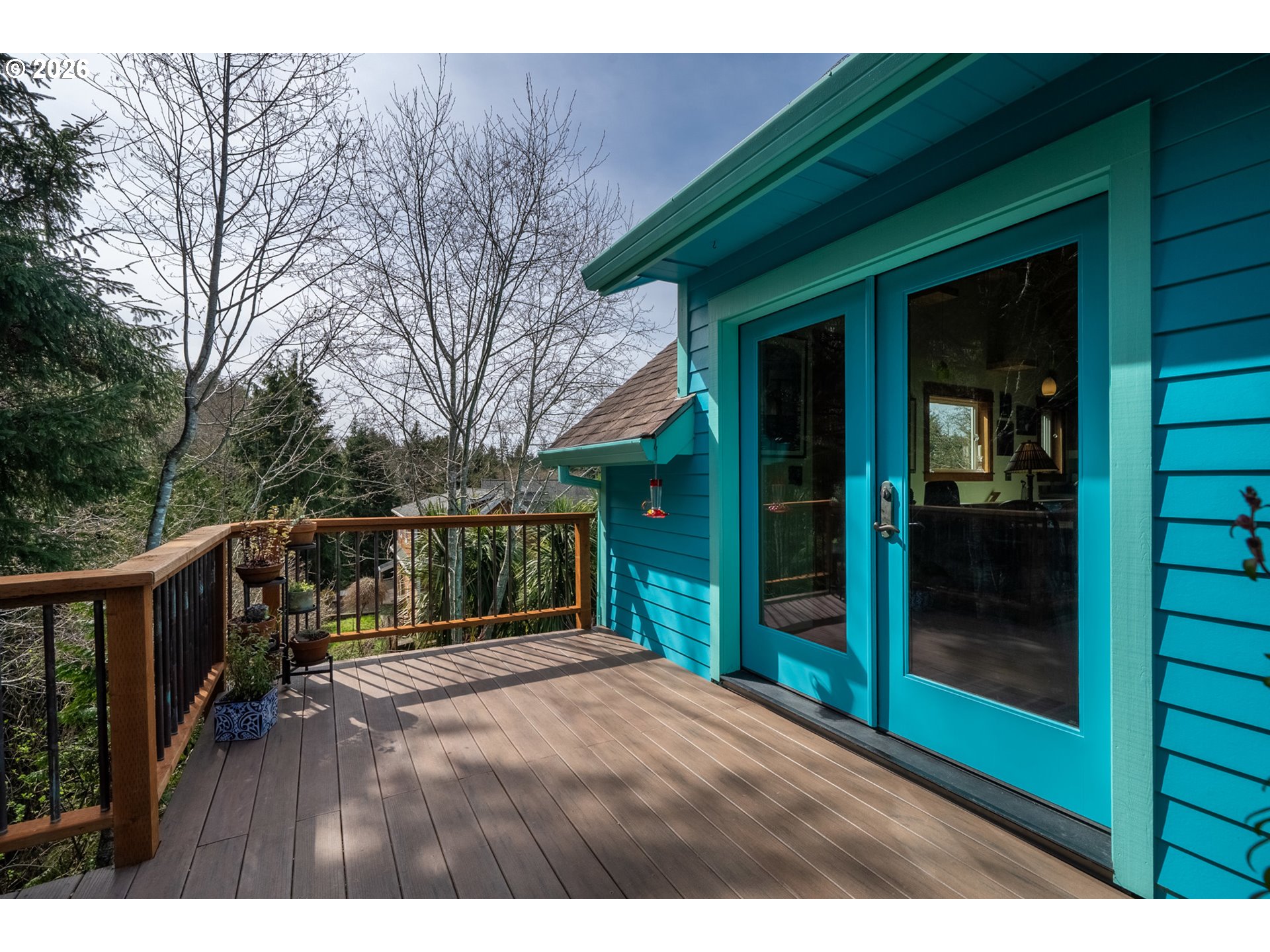 1055 Phelps Street Tillamook, OR 97141 - Photo 29 of 40 a view of backyard with small cabin and wooden fence