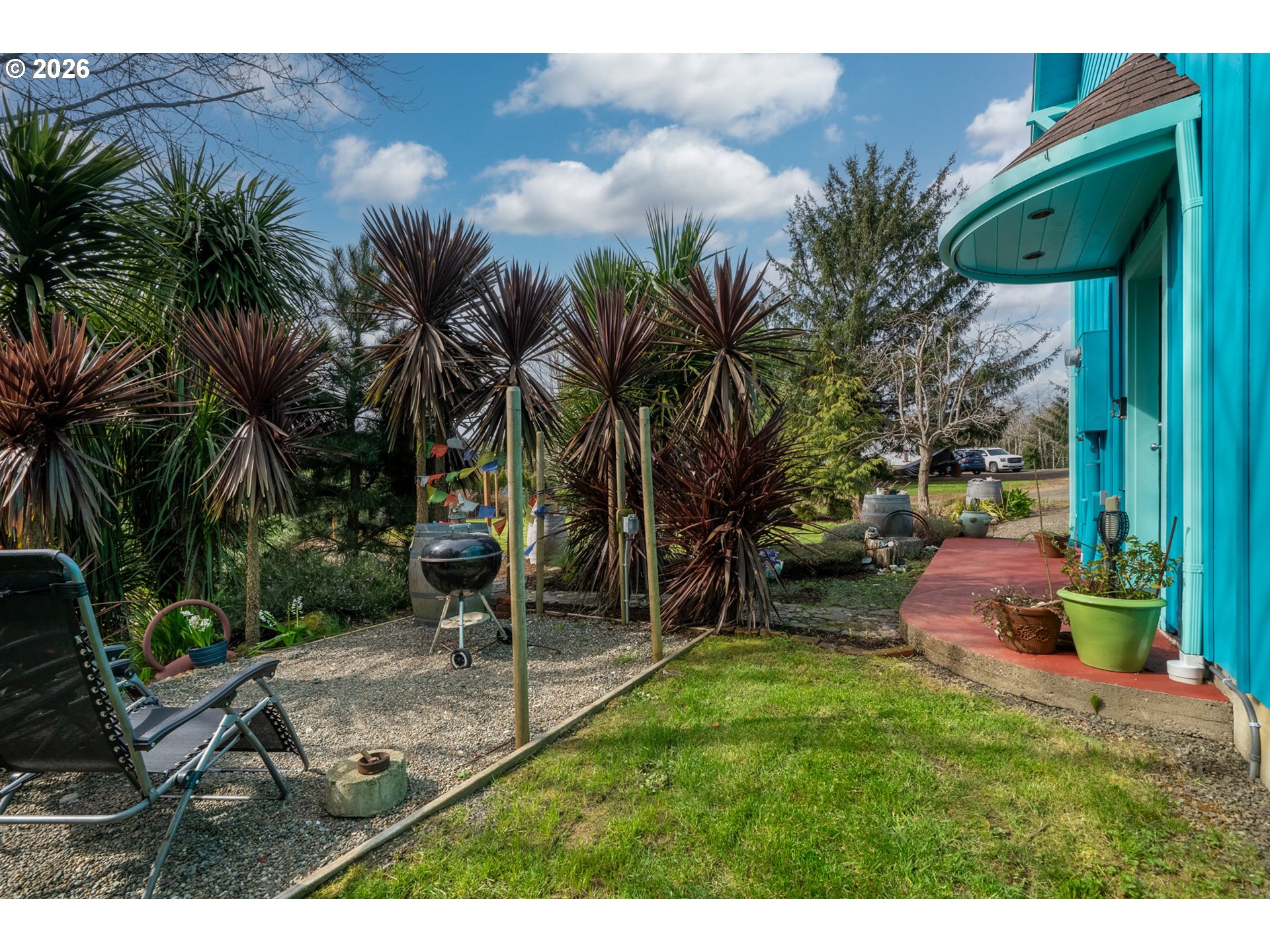 1055 Phelps Street Tillamook, OR 97141 - Photo 35 of 40 a garden view with a fountain