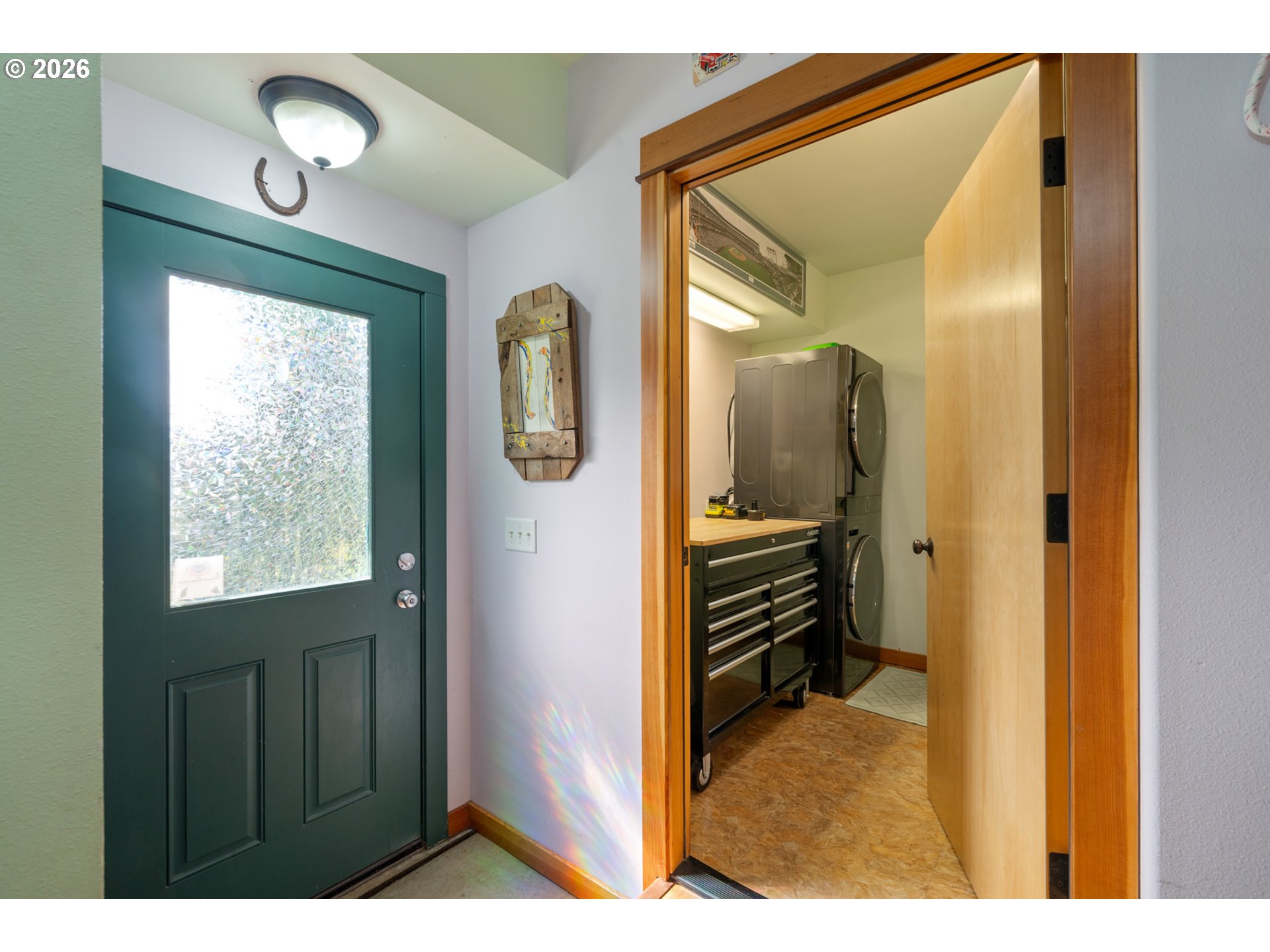 1055 Phelps Street Tillamook, OR 97141 - Photo 5 of 40 a view of hallway with bathroom and a window