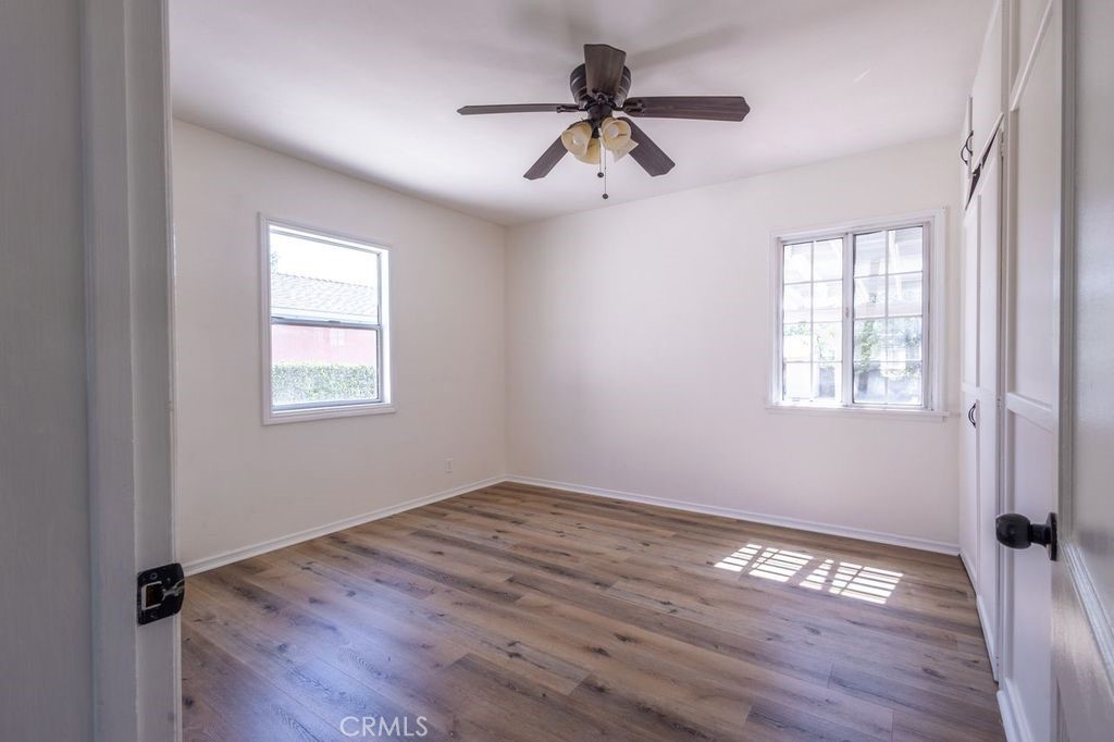 310 Wyland Way Duarte, CA 91010 - Photo 12 of 20 a view of empty room with wooden floor and fan