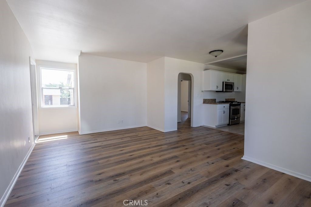 310 Wyland Way Duarte, CA 91010 - Photo 3 of 20 a view of empty room with wooden floor and window