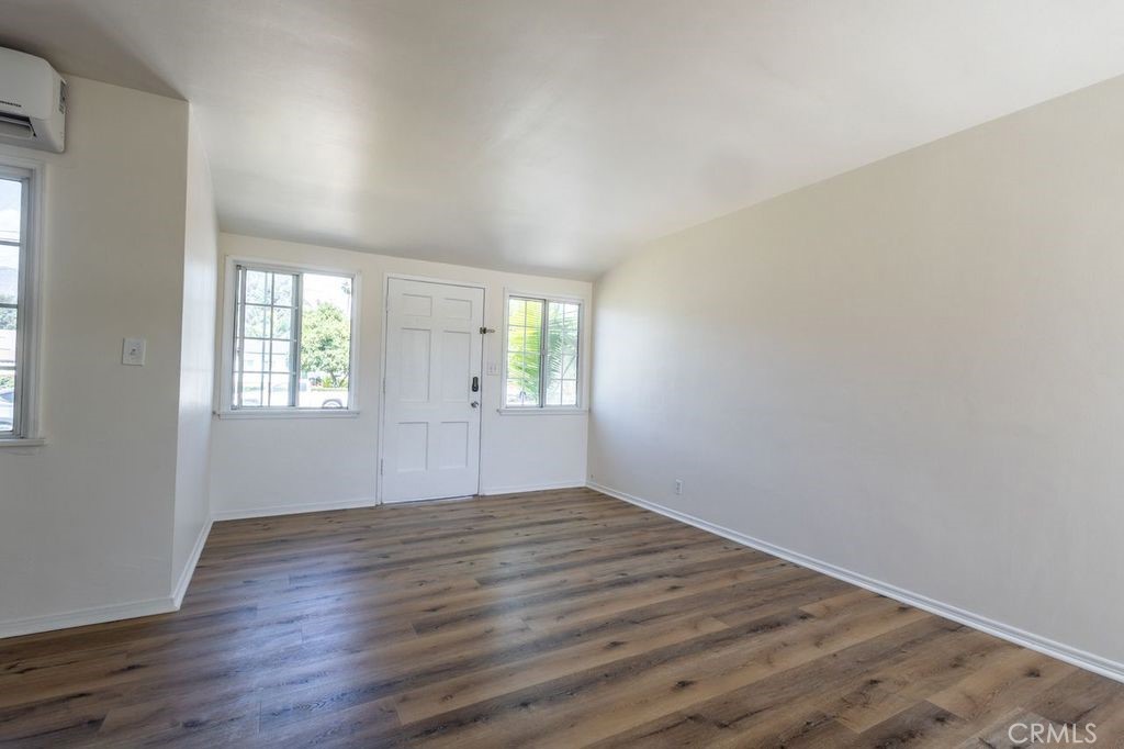 310 Wyland Way Duarte, CA 91010 - Photo 6 of 20 an empty room with wooden floor and windows