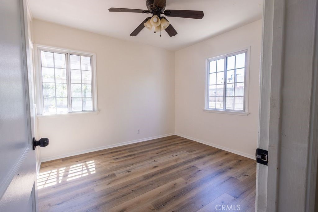 310 Wyland Way Duarte, CA 91010 - Photo 10 of 20 a view of an empty room with wooden floor and a window