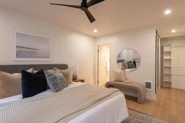 a bedroom with bed and window