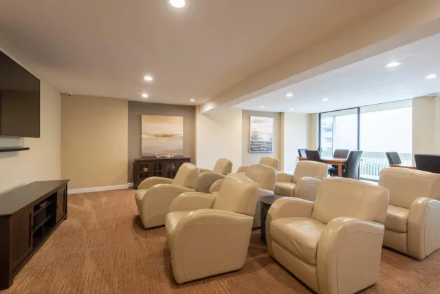a room with pool table and windows