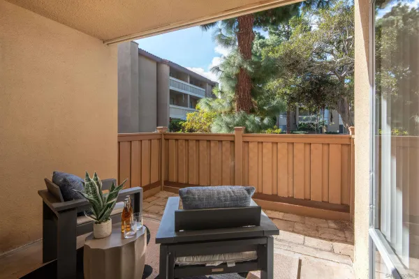 a view of a balcony with furniture