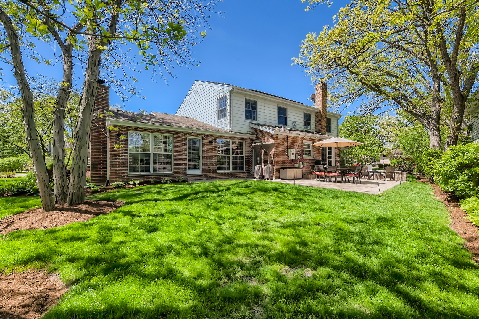 506 Warwick Road Deerfield, IL 60015 - Photo 34 of 34 a front view of a house with yard and green space