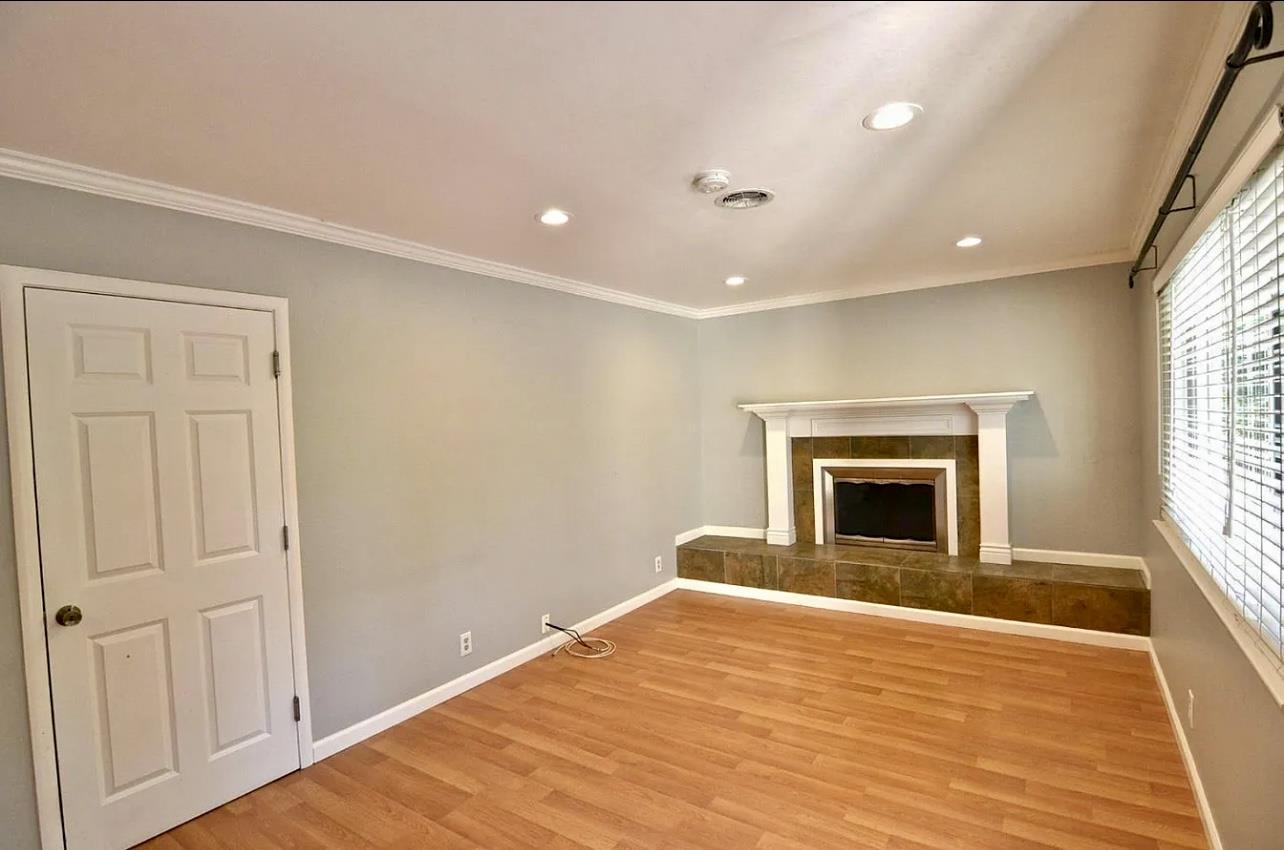 1377 Virginia Avenue Campbell, CA 95008 - Photo 16 of 29 a view of empty room with a fireplace and wooden floor