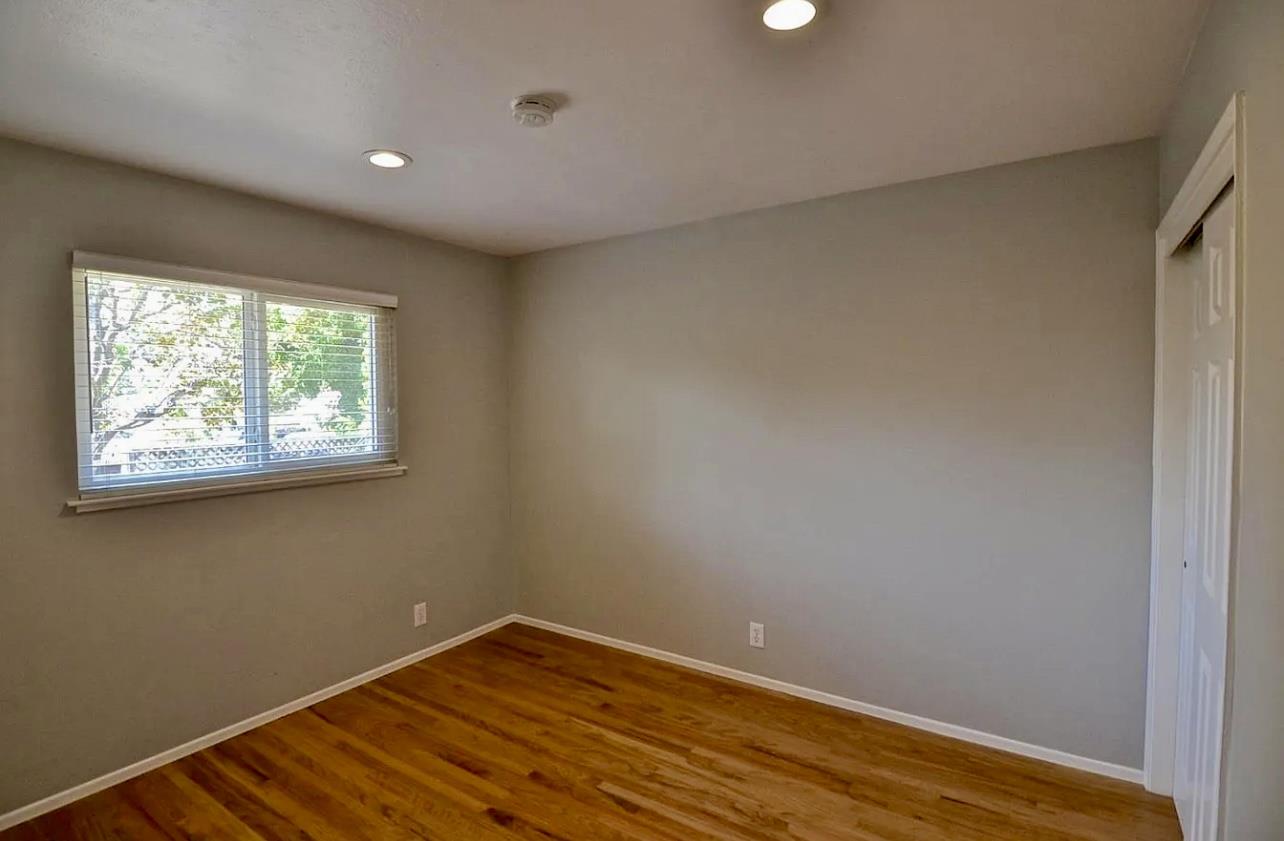 1377 Virginia Avenue Campbell, CA 95008 - Photo 25 of 29 a view of an empty room with wooden floor and a window