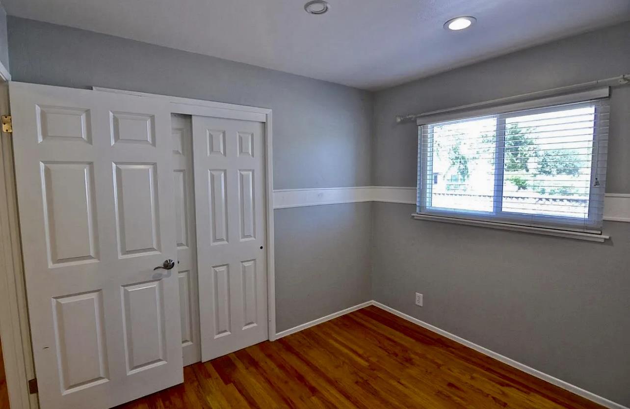 1377 Virginia Avenue Campbell, CA 95008 - Photo 26 of 29 an empty room with wooden floor and windows