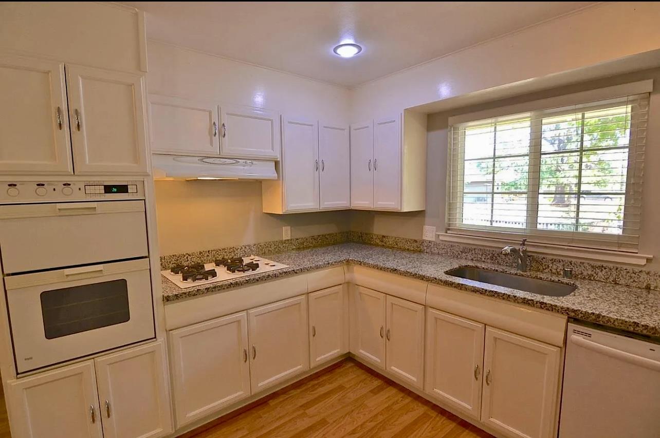1377 Virginia Avenue Campbell, CA 95008 - Photo 7 of 29 a kitchen with a sink stove and cabinets