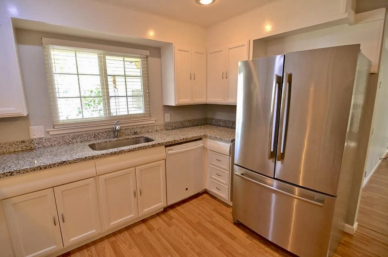 1377 Virginia Avenue Campbell, CA 95008 - Photo 8 of 29 a kitchen with stainless steel appliances granite countertop a refrigerator and a sink