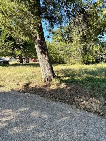 a view of a lake with lots of green space