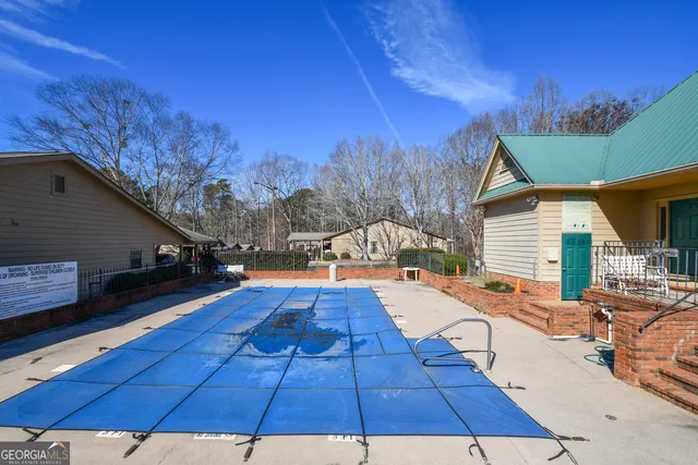 a view of a backyard with sitting area