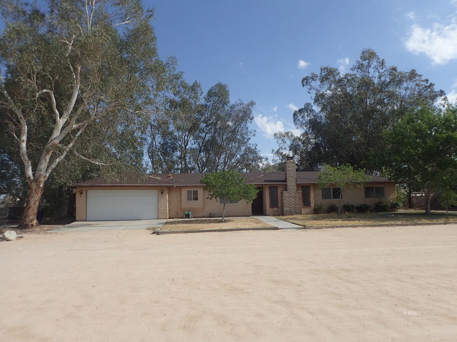 3612 Alene Avenue Ridgecrest, CA 93555 - Photo 1 of 17 a front view of house with yard and trees in the background