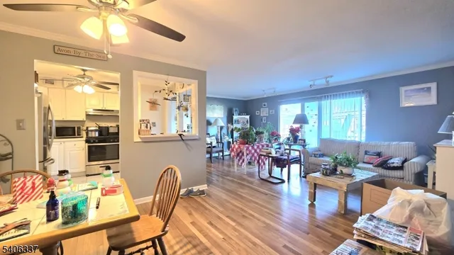 a dining room with furniture window wooden floor