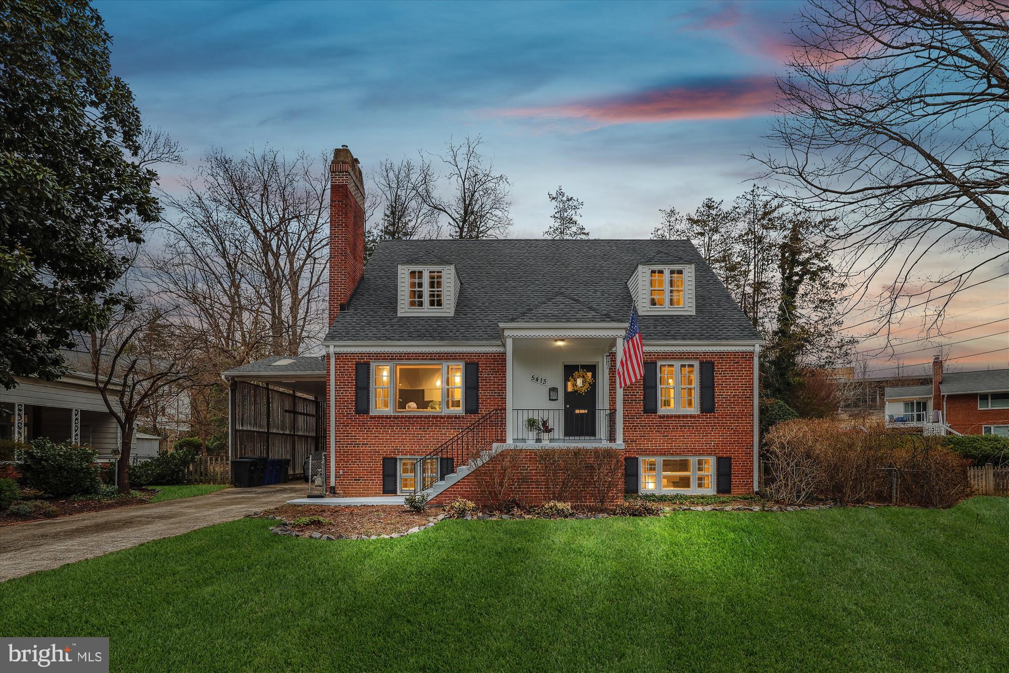 front view of a house with a yard