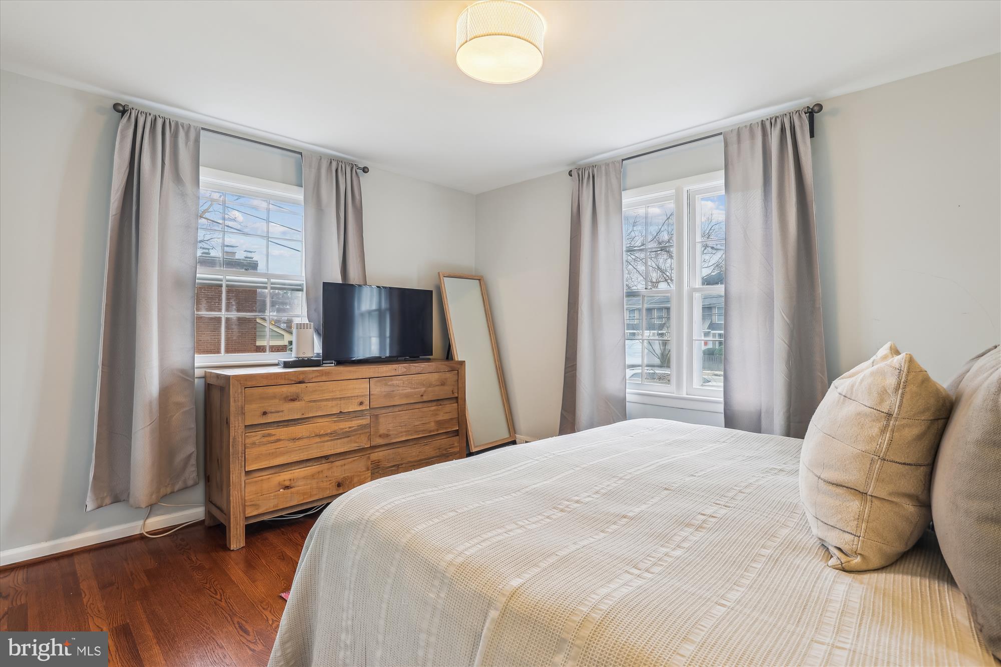 5413 Williamsburg Boulevard Arlington, VA 22207 - Photo 11 of 34 a bedroom with a bed and a large window