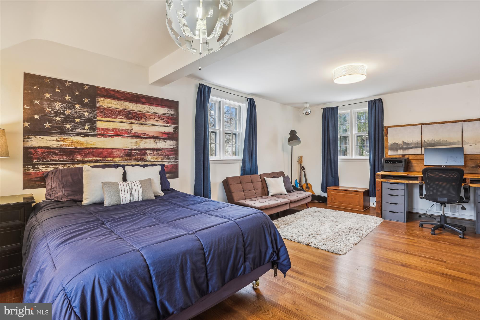 5413 Williamsburg Boulevard Arlington, VA 22207 - Photo 16 of 34 a bedroom with a large bed a rug and windows