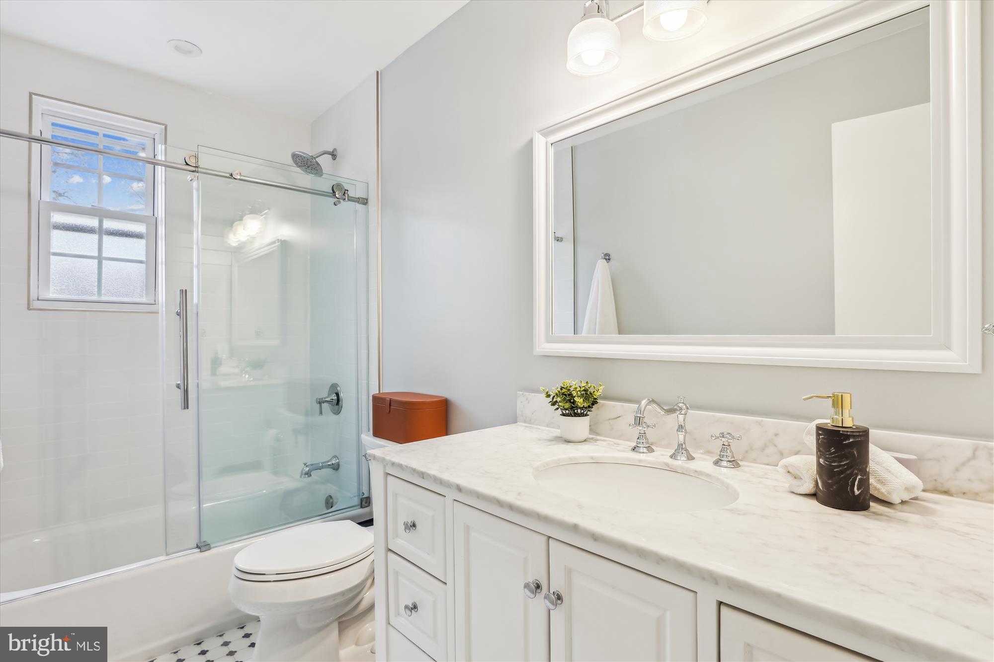 5413 Williamsburg Boulevard Arlington, VA 22207 - Photo 18 of 34 a bathroom with a granite countertop sink toilet and shower