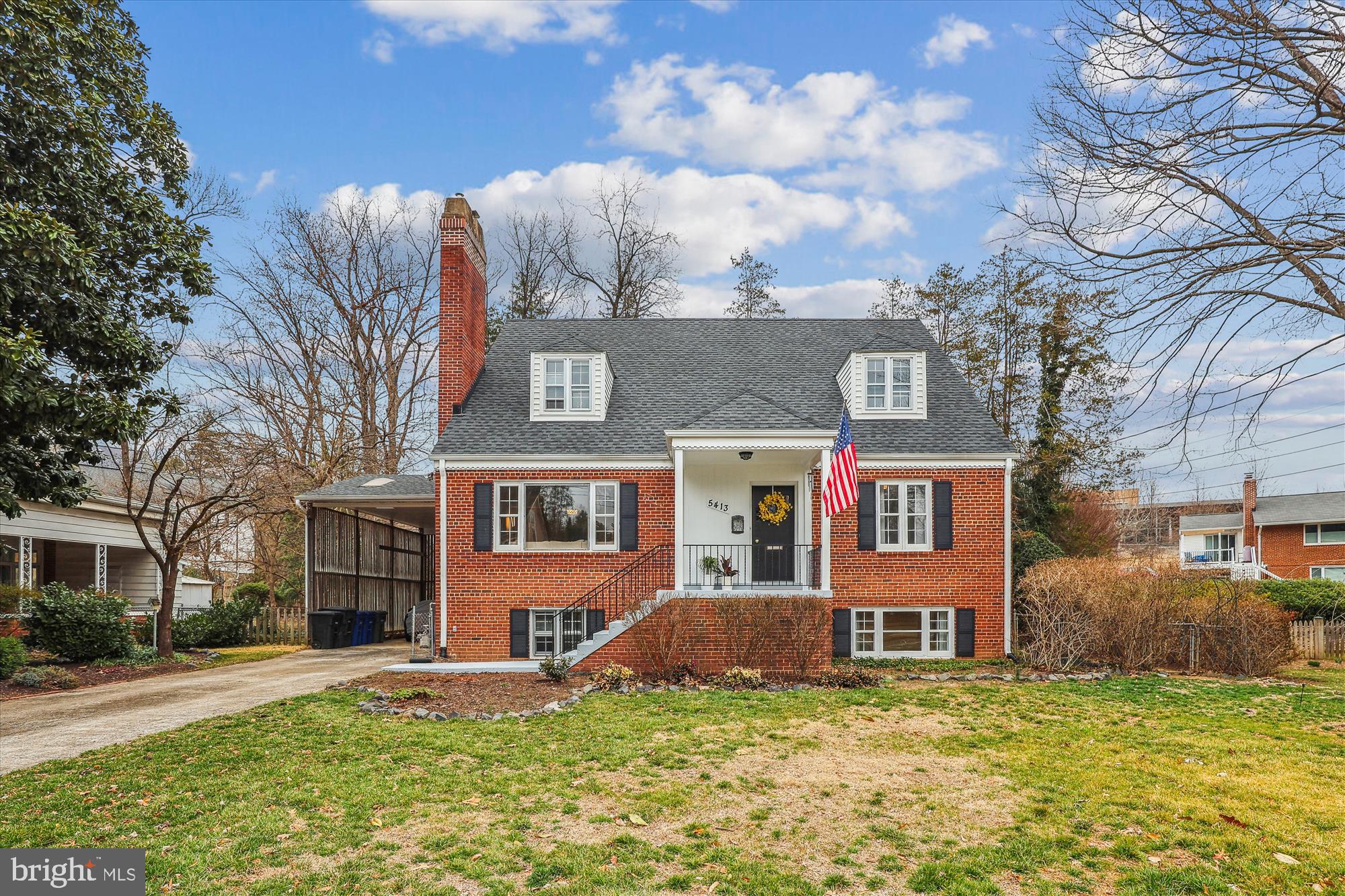 5413 Williamsburg Boulevard Arlington, VA 22207 - Photo 2 of 34 a view of a house with a big yard and large tree