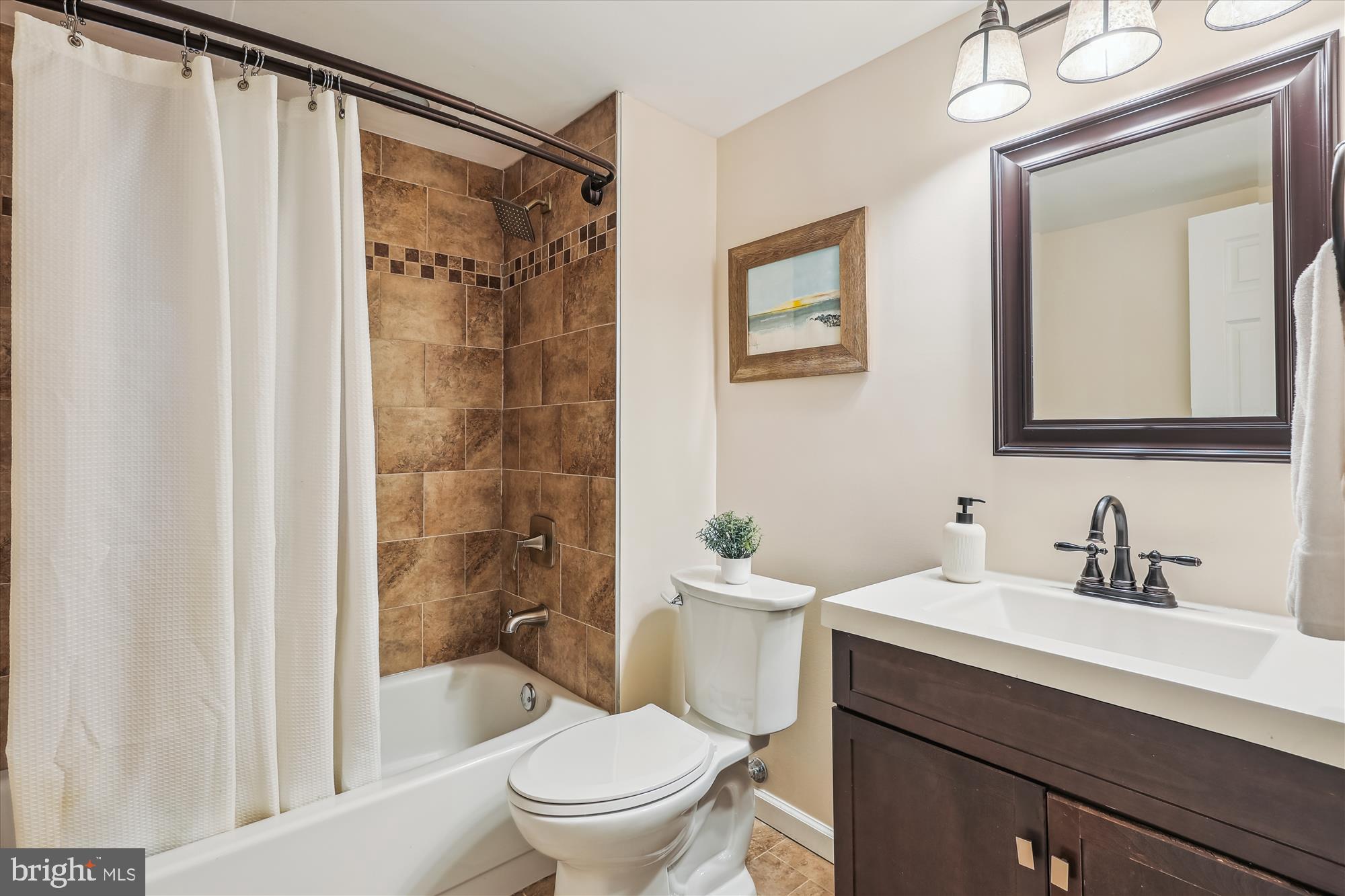 5413 Williamsburg Boulevard Arlington, VA 22207 - Photo 25 of 34 a bathroom with a sink mirror toilet and shower