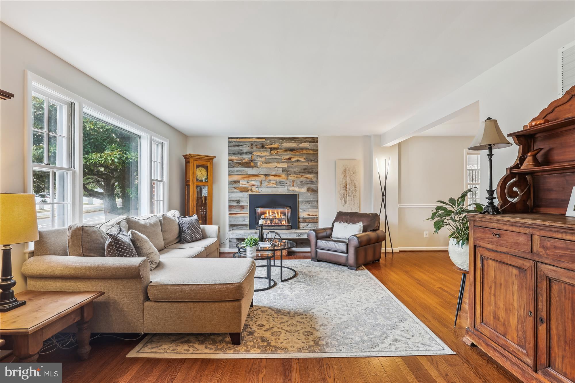 5413 Williamsburg Boulevard Arlington, VA 22207 - Photo 4 of 34 a living room with furniture large window and a fireplace