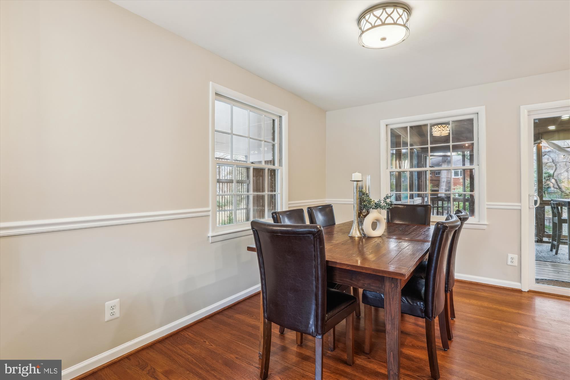 5413 Williamsburg Boulevard Arlington, VA 22207 - Photo 6 of 34 a view of a dining room with furniture window and wooden floor
