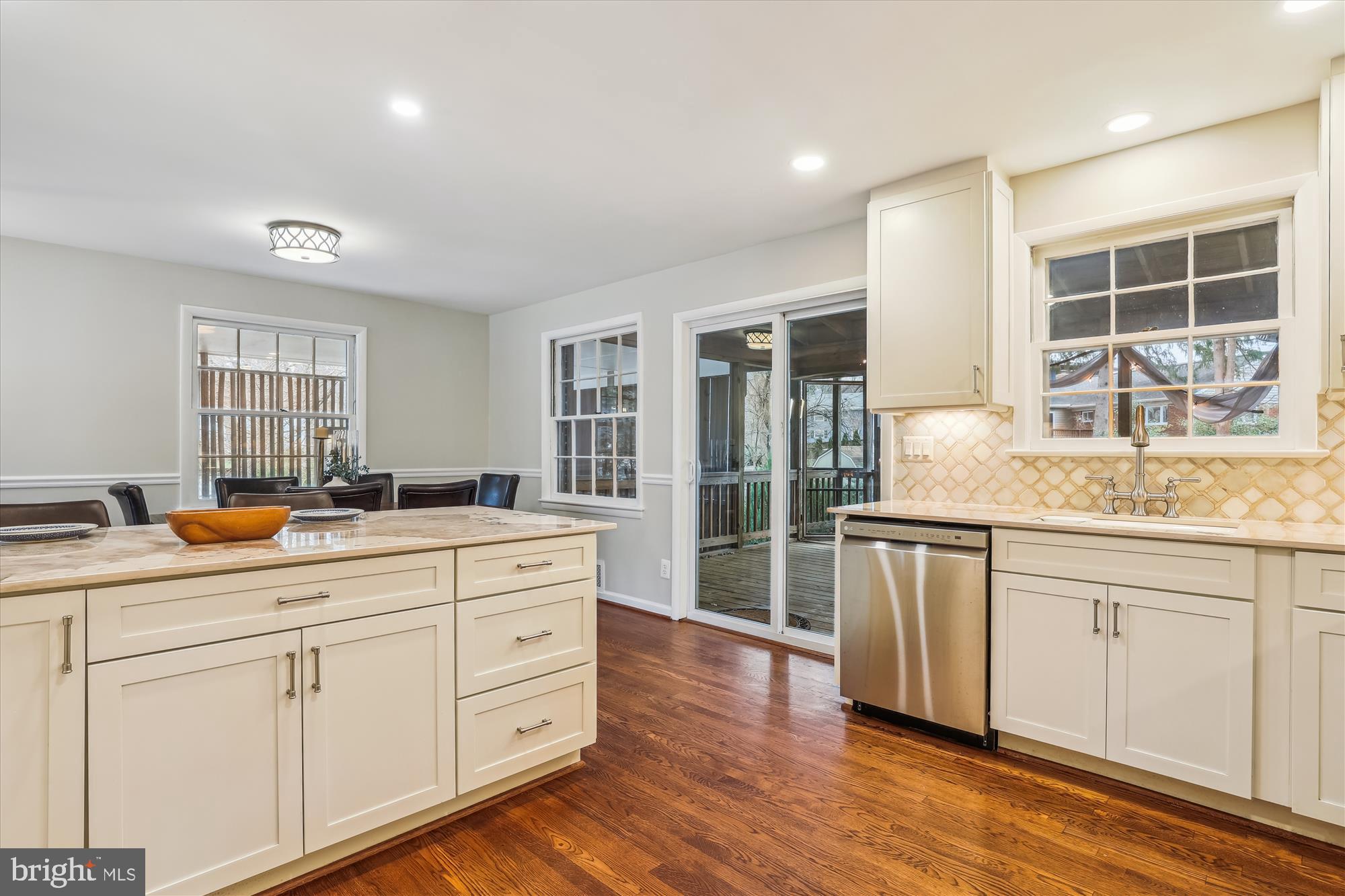 5413 Williamsburg Boulevard Arlington, VA 22207 - Photo 9 of 34 a kitchen with white cabinets and sink