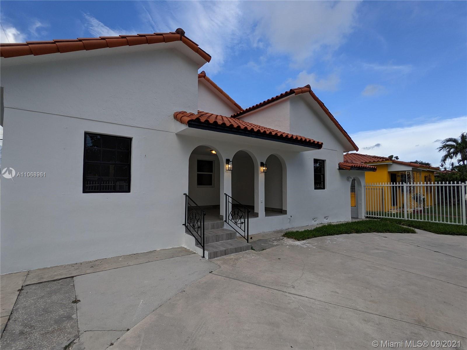5675 Southwest 5th Street Miami, FL 33134 - Photo 2 of 20 a house view with a backyard space