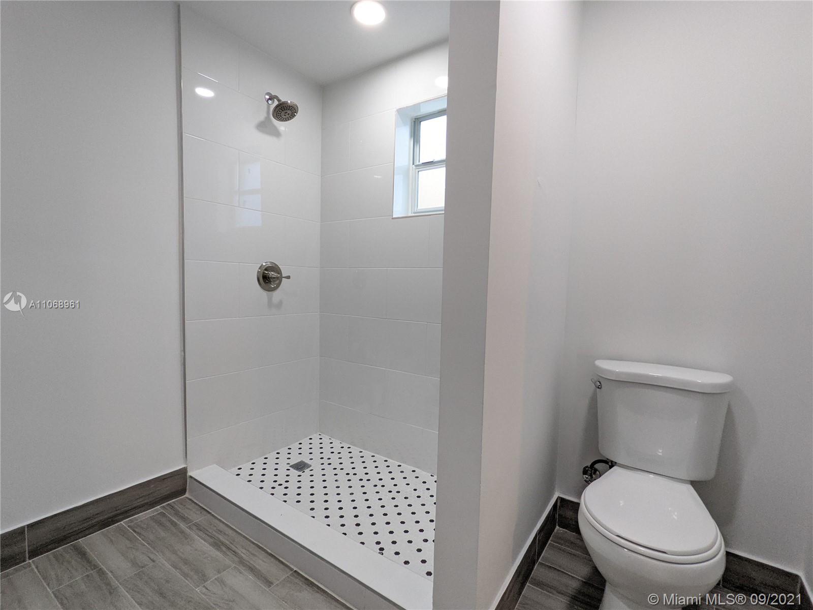 5675 Southwest 5th Street Miami, FL 33134 - Photo 16 of 20 a bathroom with a toilet and a shower