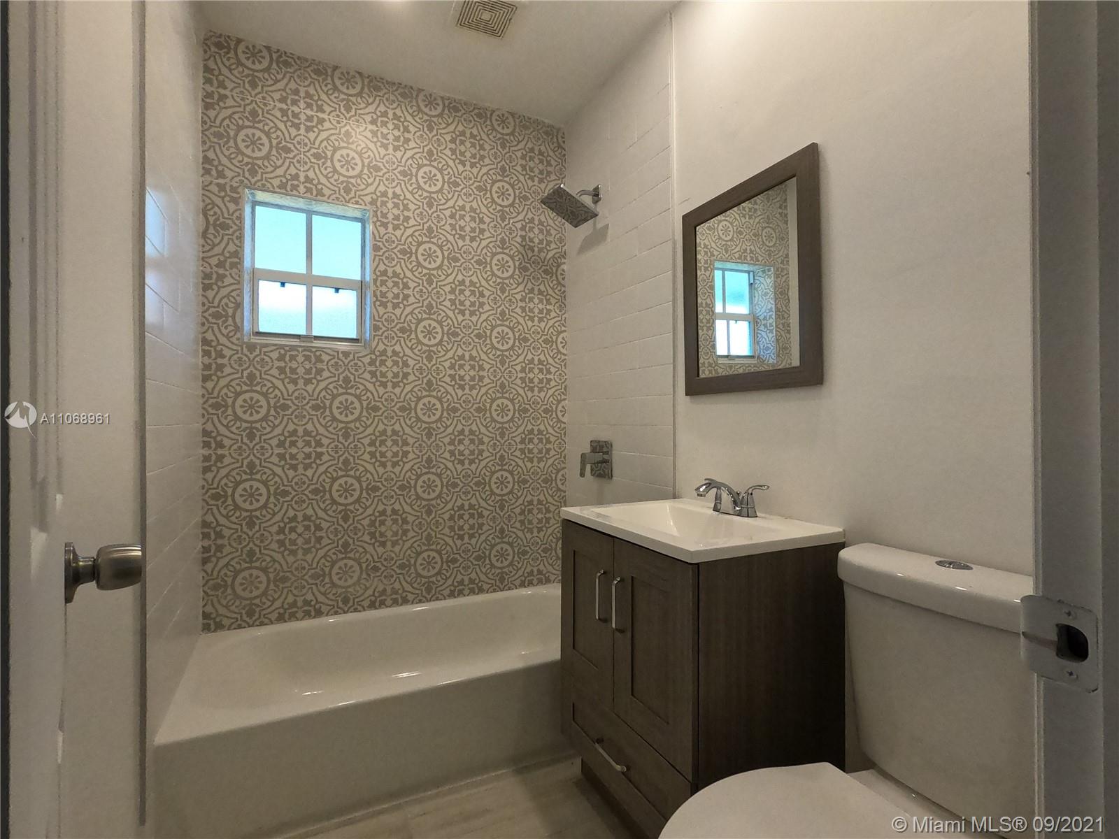 5675 Southwest 5th Street Miami, FL 33134 - Photo 18 of 20 a bathroom with a sink toilet and bathtub