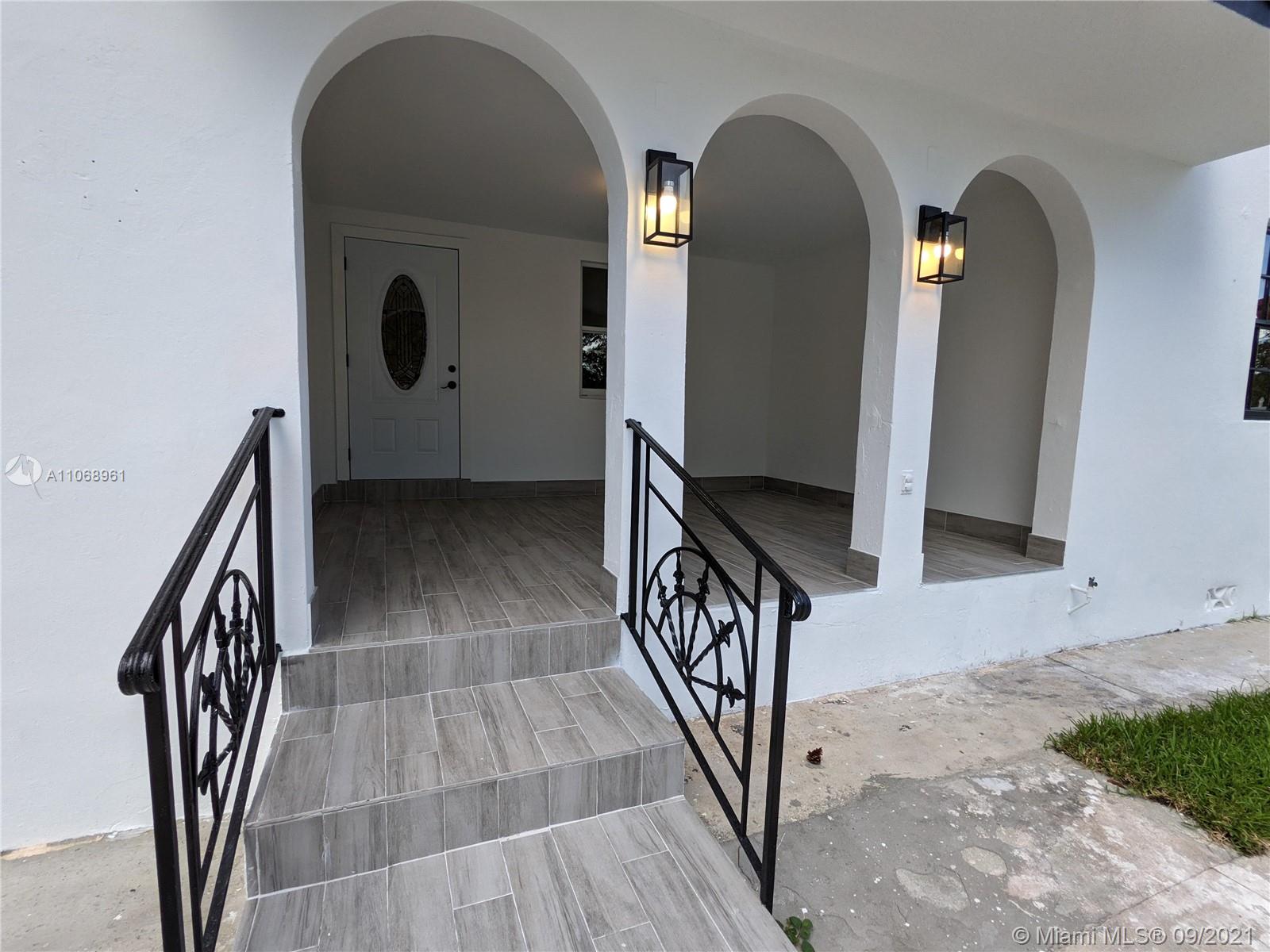 5675 Southwest 5th Street Miami, FL 33134 - Photo 5 of 20 a view of staircase with wooden floor and stairs