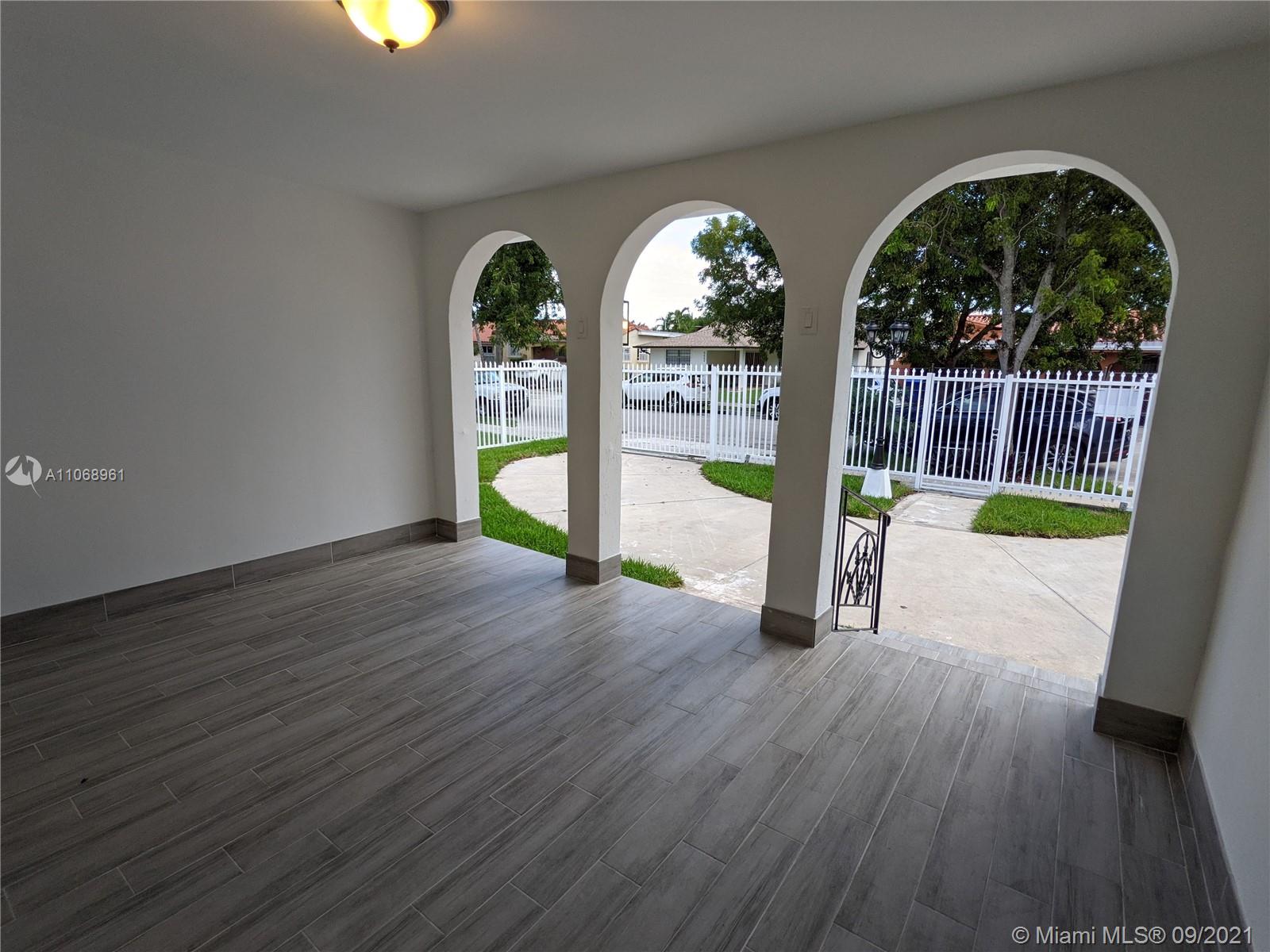 5675 Southwest 5th Street Miami, FL 33134 - Photo 6 of 20 a view of entryway with wooden floor