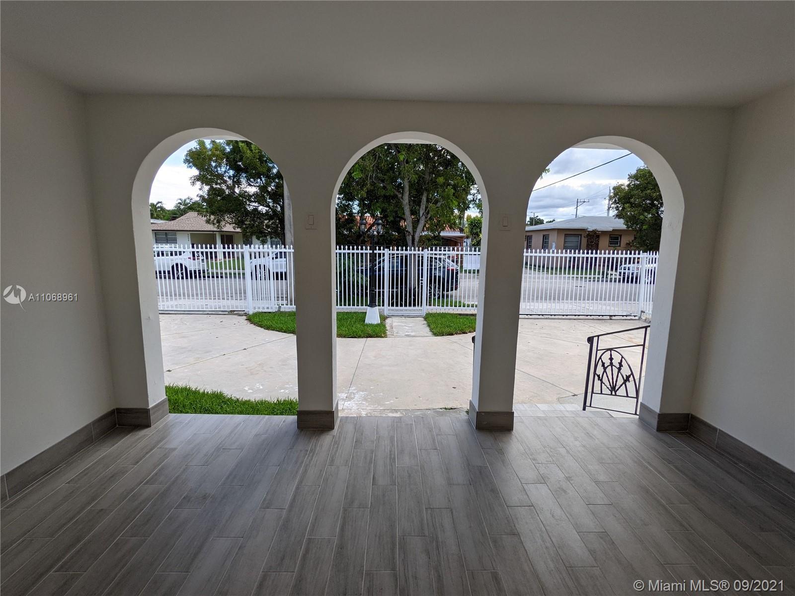 5675 Southwest 5th Street Miami, FL 33134 - Photo 7 of 20 a view of front door with wooden floor