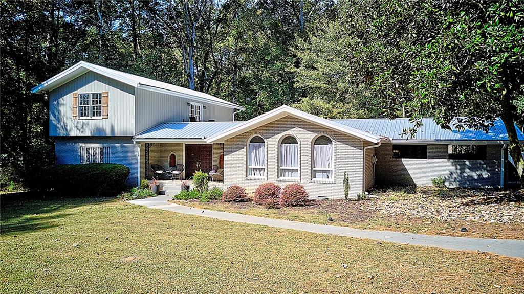 185 Gatewood Place Athens, GA 30607 - Photo 1 of 1 a front view of a house with a yard