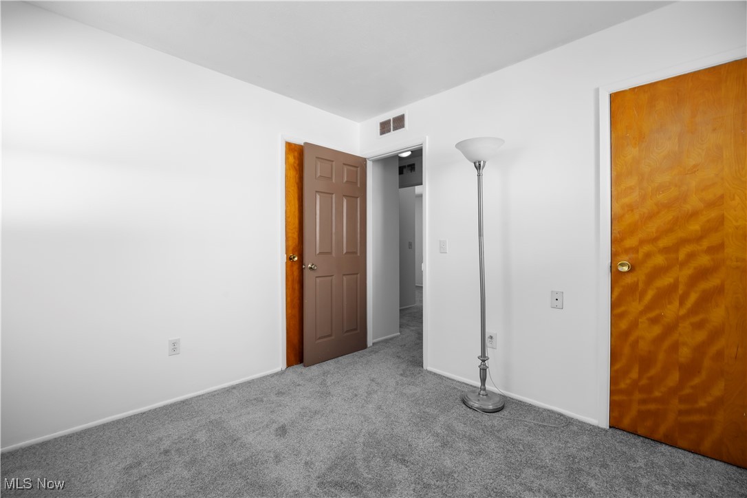 1065 Inland Street Vermilion, OH 44089 - Photo 24 of 50 Unfurnished bedroom featuring carpet and baseboards