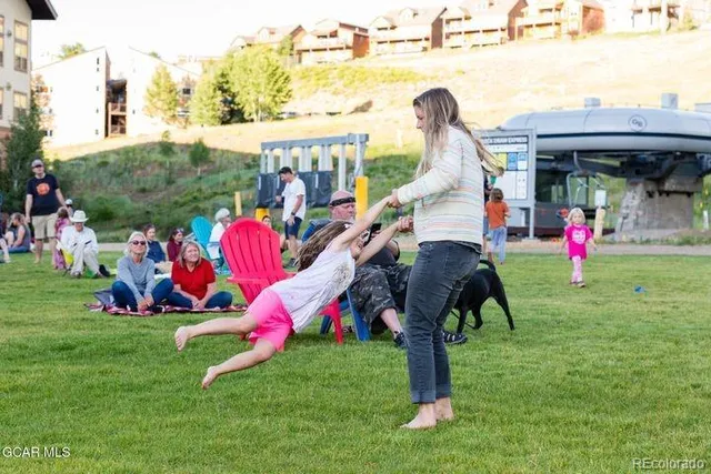 a backyard of a house with barbeque oven and garden