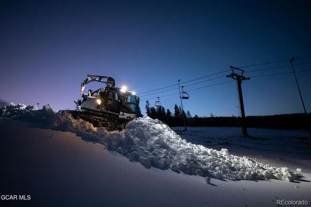 a view of a lake in middle of the mountain