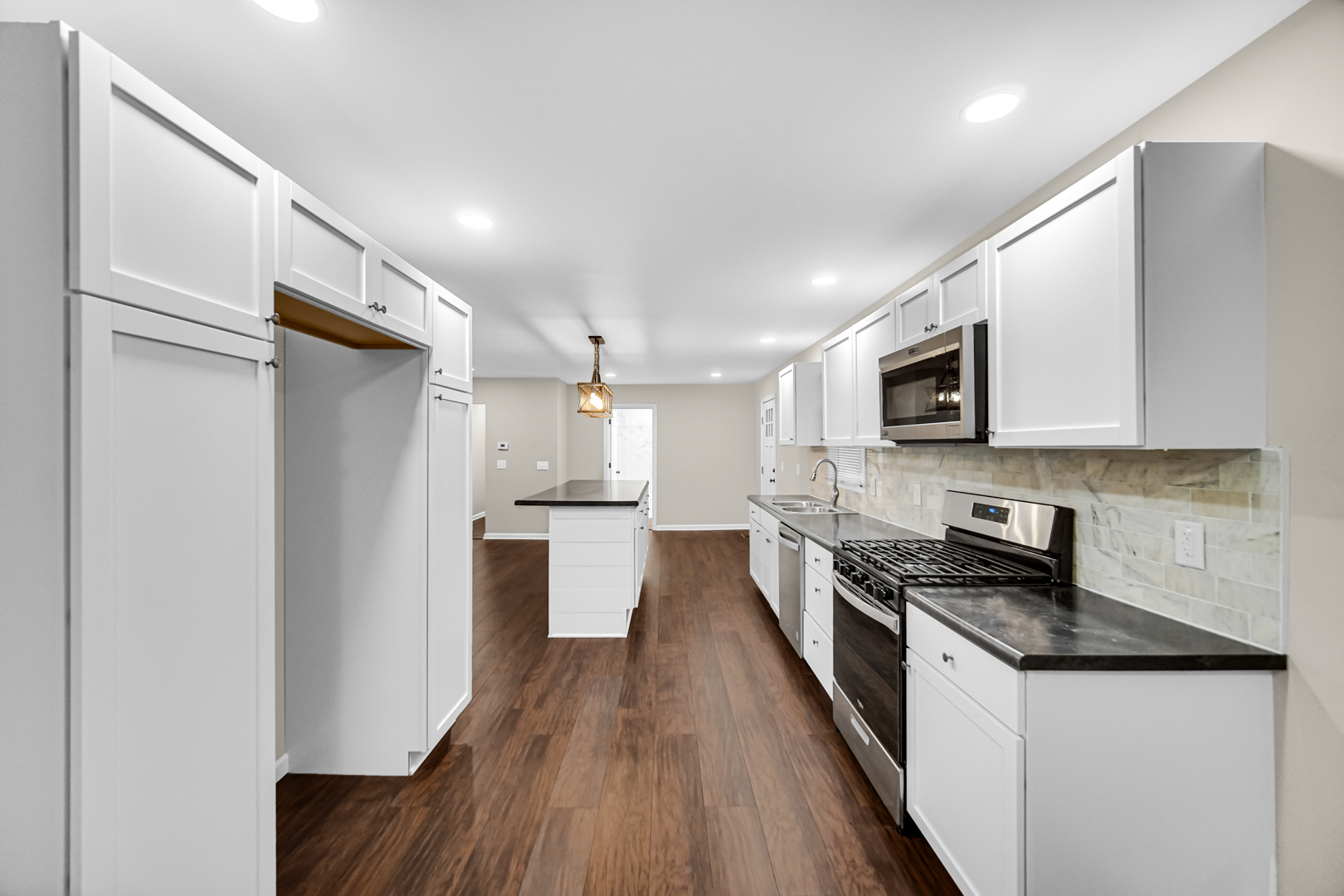 6226 East 250S Road St. Anne, IL 60964 - Photo 11 of 22 a kitchen with stainless steel appliances granite countertop a refrigerator a stove top oven a sink and dishwasher