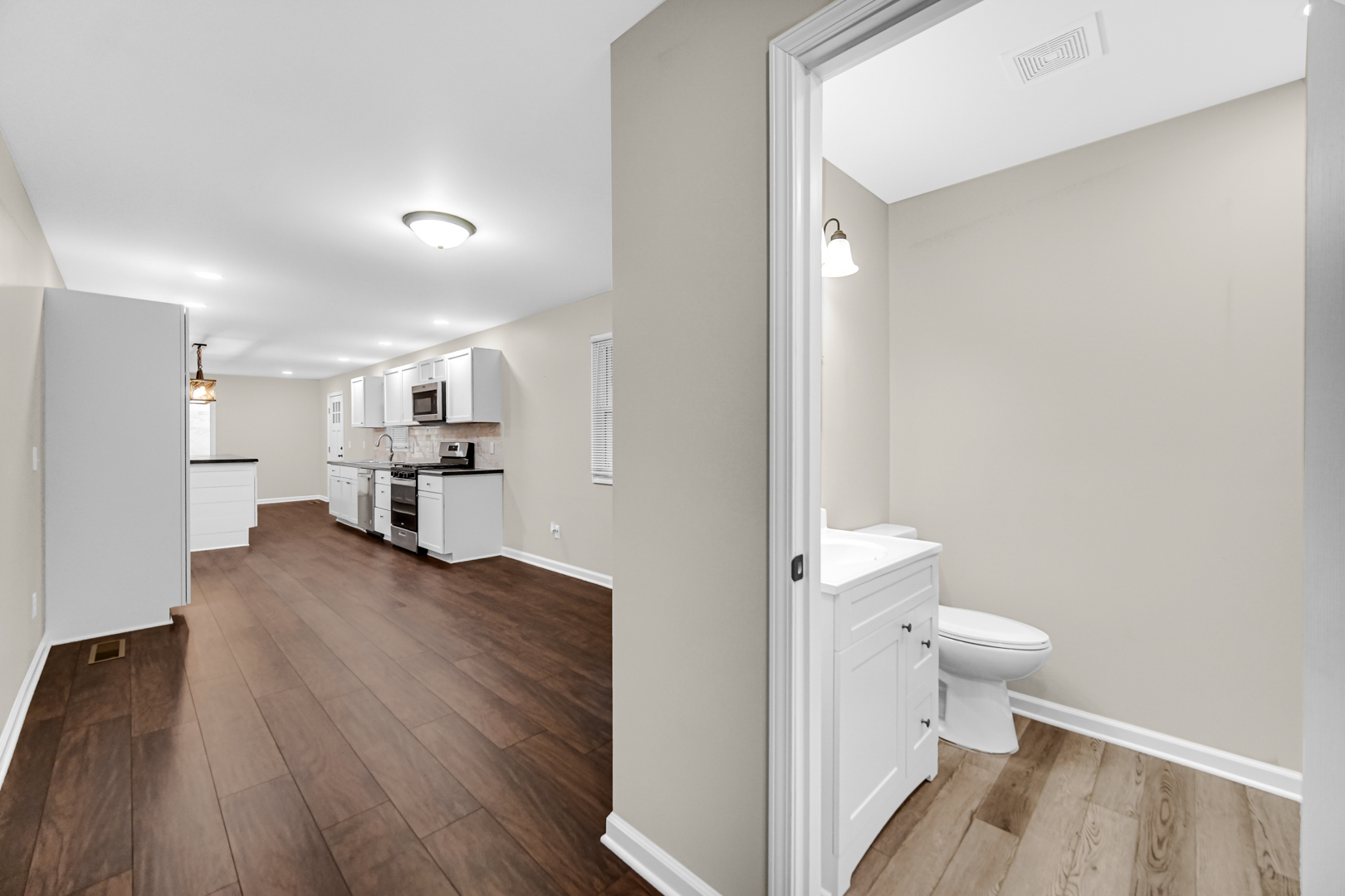 6226 East 250S Road St. Anne, IL 60964 - Photo 13 of 22 a view of bathroom with a toilet sink and a mirror