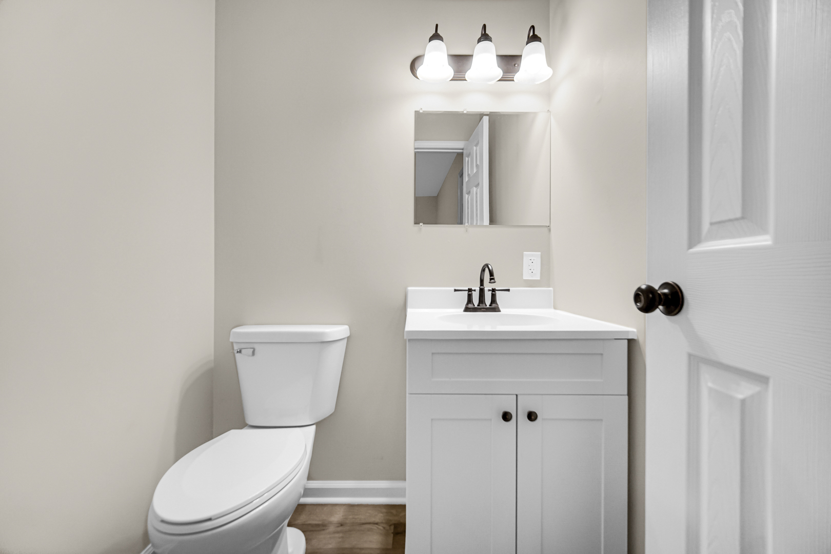 6226 East 250S Road St. Anne, IL 60964 - Photo 16 of 22 a white toilet sitting next to a bathroom sink