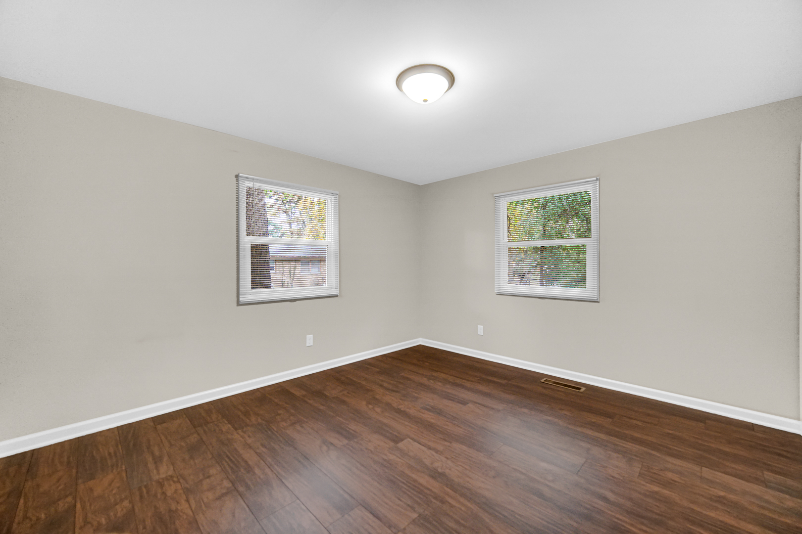 6226 East 250S Road St. Anne, IL 60964 - Photo 17 of 22 an empty room with wooden floor and windows