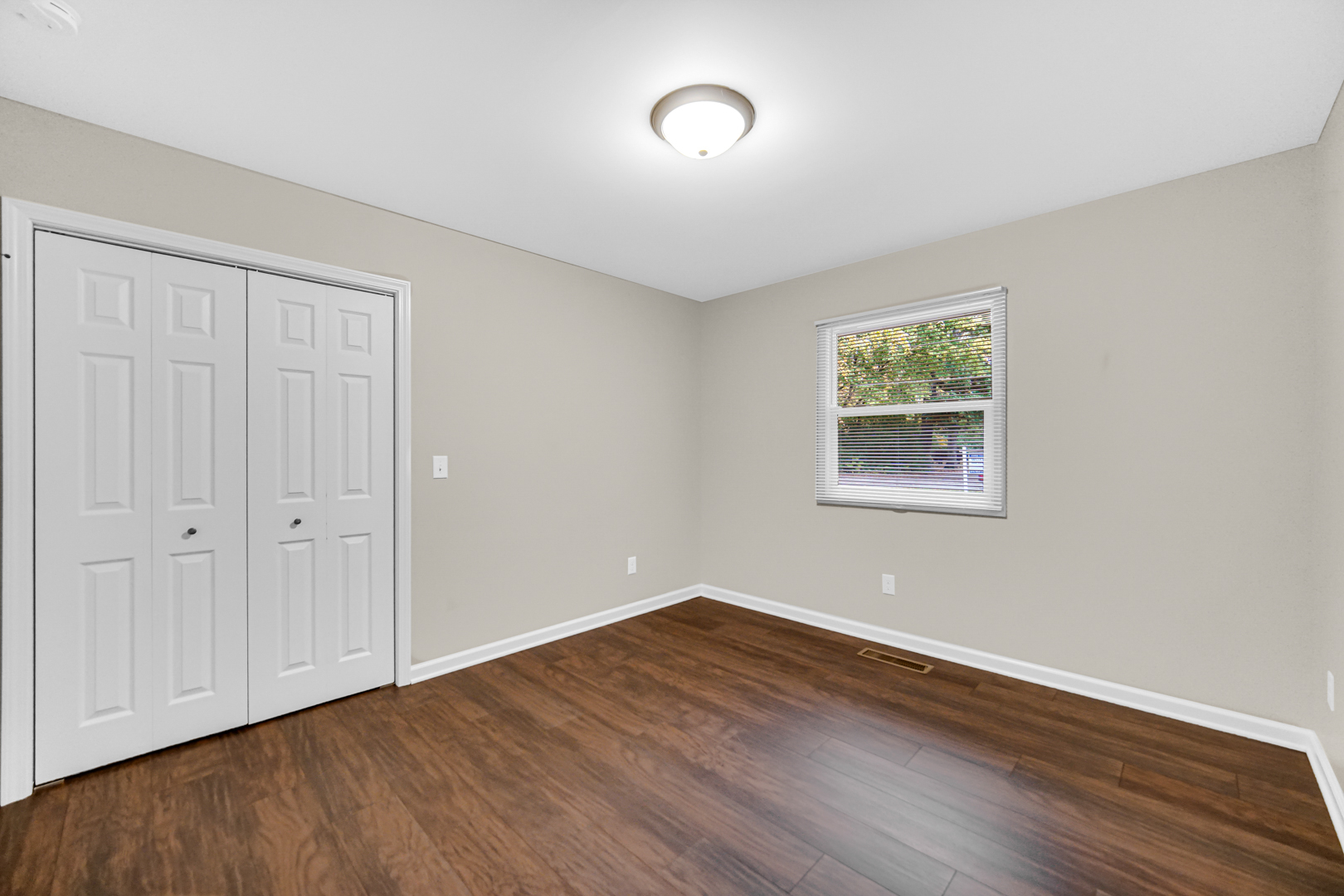 6226 East 250S Road St. Anne, IL 60964 - Photo 18 of 22 a view of an empty room with wooden floor and a window