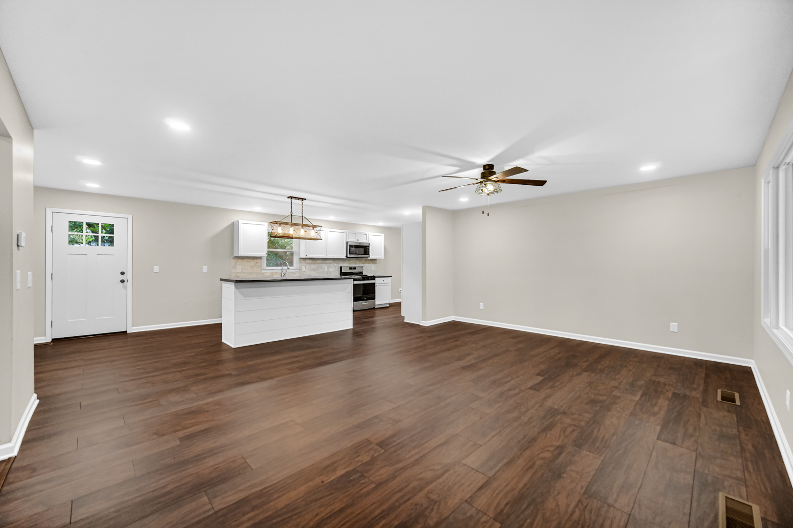 6226 East 250S Road St. Anne, IL 60964 - Photo 6 of 22 a view of a kitchen with a dishwasher and wooden floor