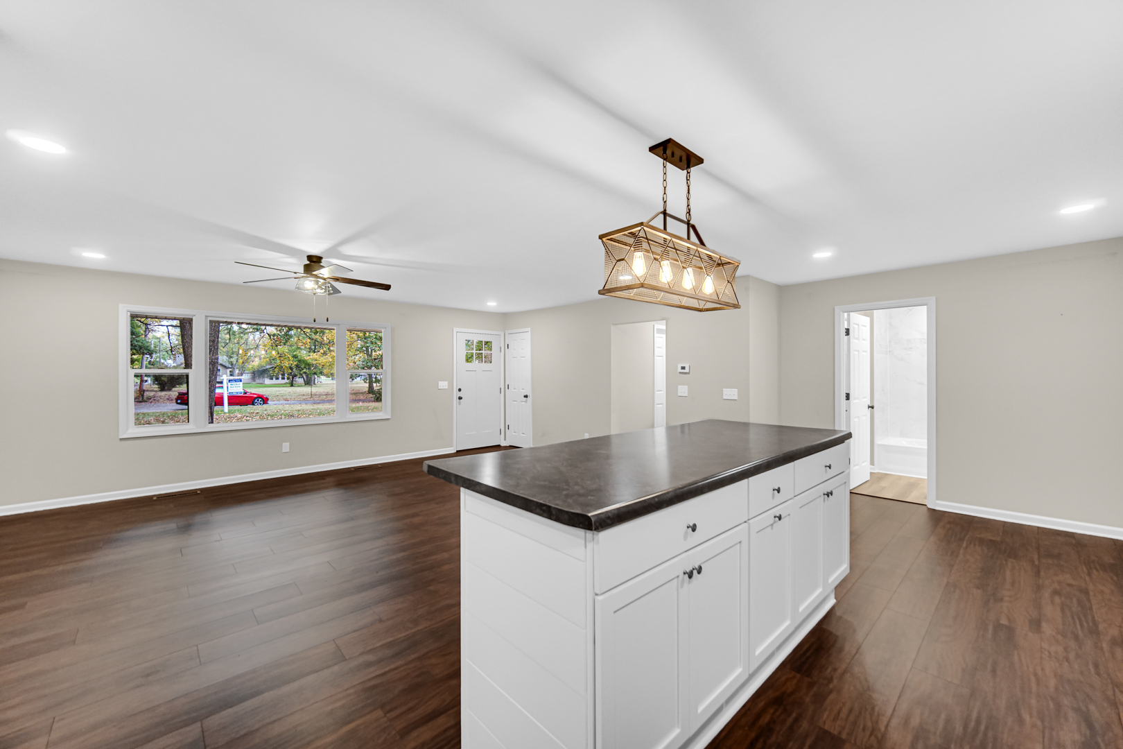 6226 East 250S Road St. Anne, IL 60964 - Photo 10 of 22 a kitchen with stainless steel appliances granite countertop a stove a sink and a wooden floors