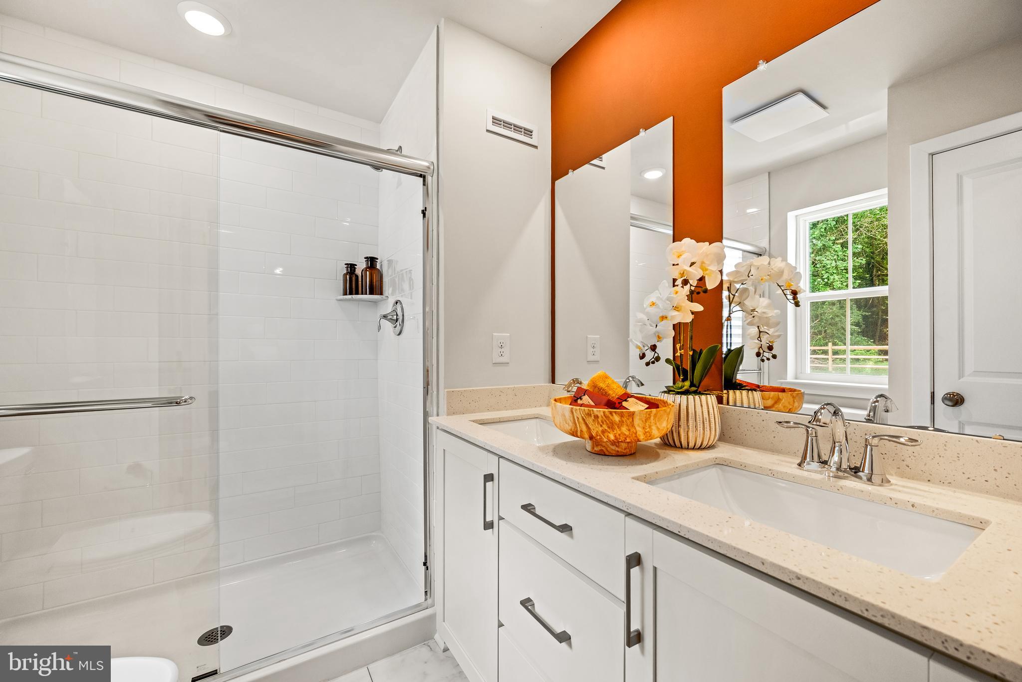 368 Mingo Way Townsend, DE 19734 - Photo 12 of 16 a bathroom with a double vanity sink and mirror