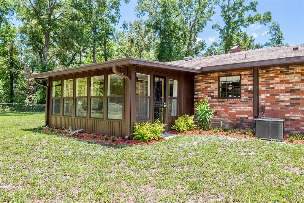 8991 Northwest 115th Street Chiefland, FL 32626 - Photo 12 of 49 a view of a house with backyard and garden